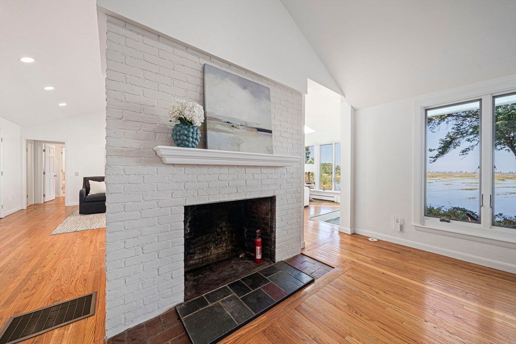 Fireplace, Interior, Recessed Lighting, Stone Walls, Water, Wood Texture Flooring