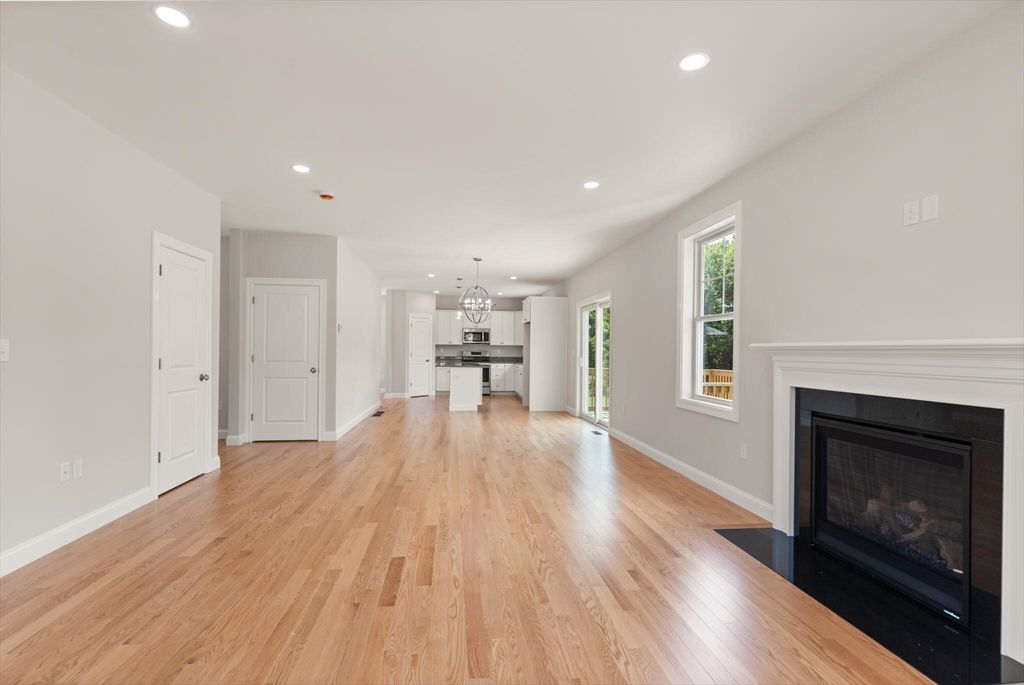 Chandelier, Empty room, Fireplace, Interior, Kitchen, Pendant Lights, Recessed Lighting, Wood Texture Flooring