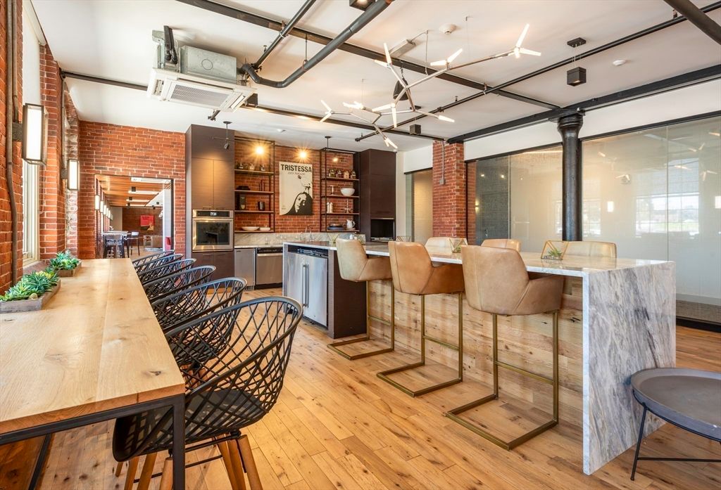 Dining room, Interior, Kitchen, Pendant Lights, Stainless Steel Appliances, Stone Walls, Wood Texture Flooring