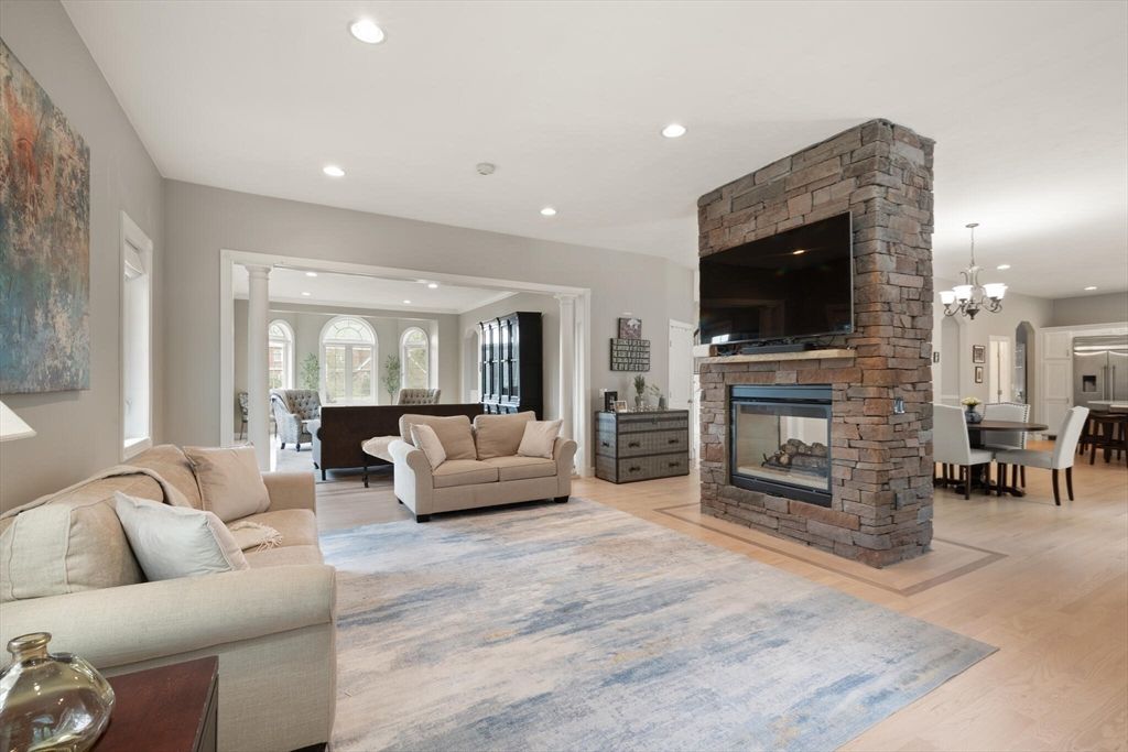 Chandelier, Dining room, Fireplace, Interior, Living room, Recessed Lighting, Stone Walls, Wood Texture Flooring