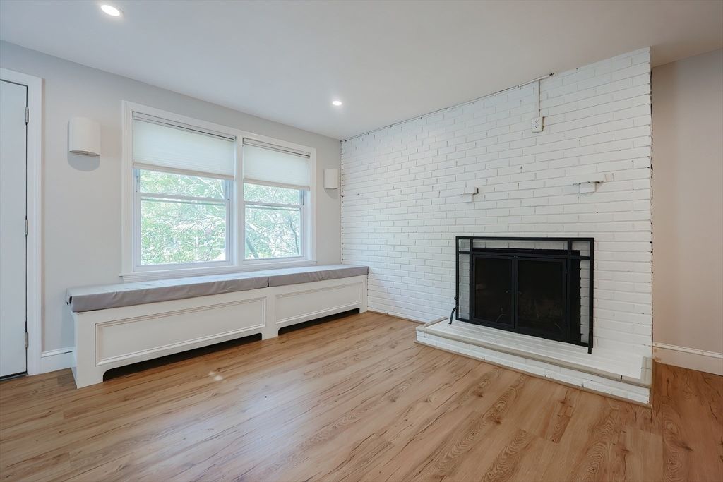 Empty room, Fireplace, Interior, Recessed Lighting, Stone Walls, Wood Texture Flooring