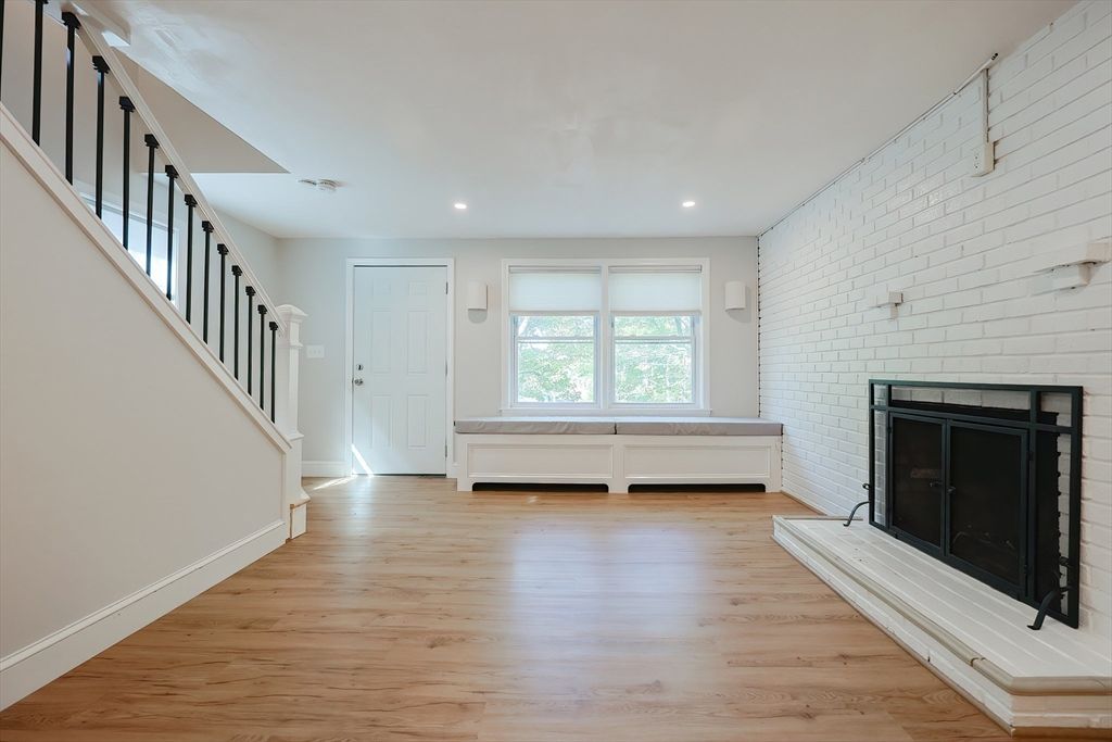 Empty room, Fireplace, Interior, Recessed Lighting, Stone Walls, Wood Texture Flooring