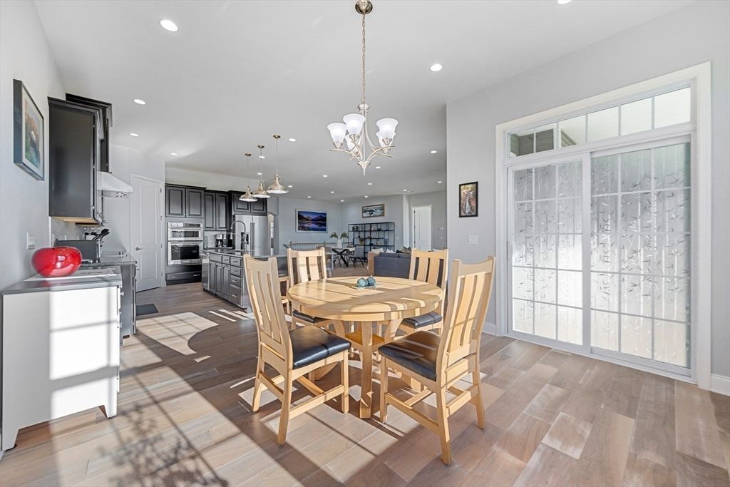 Chandelier, Dining room, Interior, Kitchen, Pendant Lights, Recessed Lighting, Stainless Steel Appliances, Wood Texture Flooring