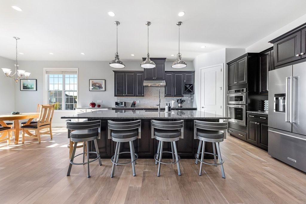 Chandelier, Dining room, Interior, Kitchen, Pendant Lights, Recessed Lighting, Stainless Steel Appliances, Wood Texture Flooring