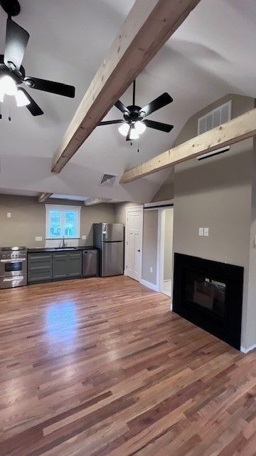 Empty room, Fireplace, Interior, Kitchen, Stainless Steel Appliances, Wooden Beams, Wood Texture Flooring
