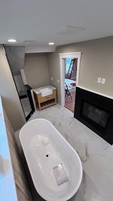 Bathroom, Free Standing Baths, Interior, Marble, Recessed Lighting, Wood Texture Flooring