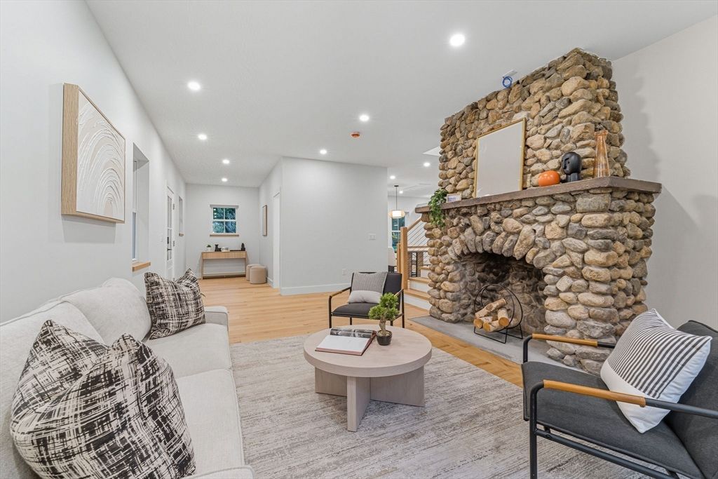 Fireplace, Interior, Living room, Recessed Lighting, Stone Walls, Wood Texture Flooring