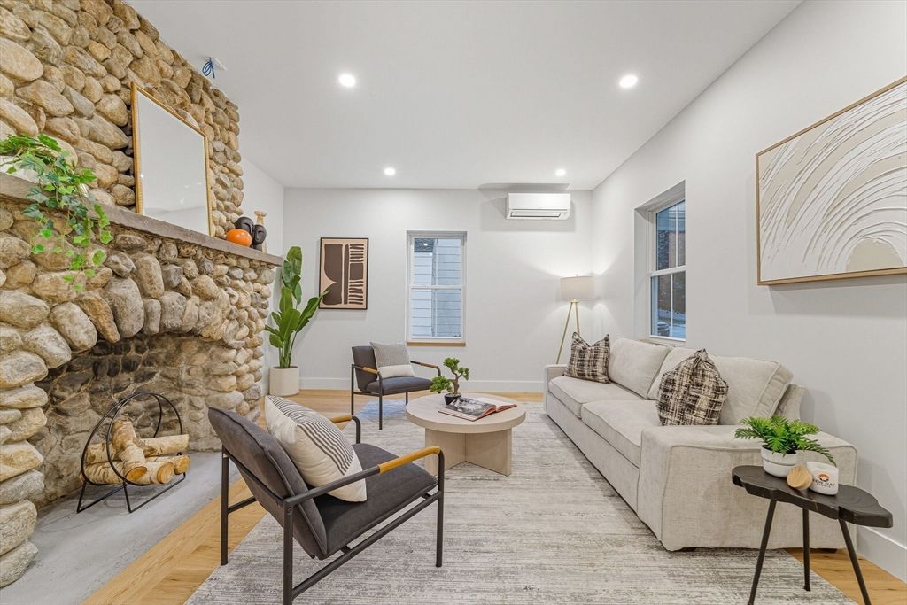 Fireplace, Interior, Living room, Recessed Lighting, Stone Walls, Wood Texture Flooring