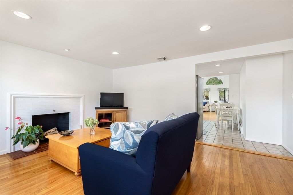 Dining room, Fireplace, Interior, Living room, Recessed Lighting, Wood Texture Flooring