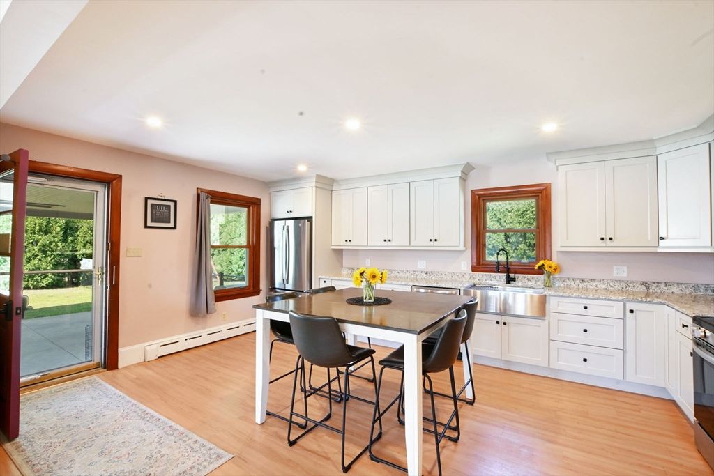 Dining room, Interior, Kitchen, Recessed Lighting, Stainless Steel Appliances, Wood Texture Flooring