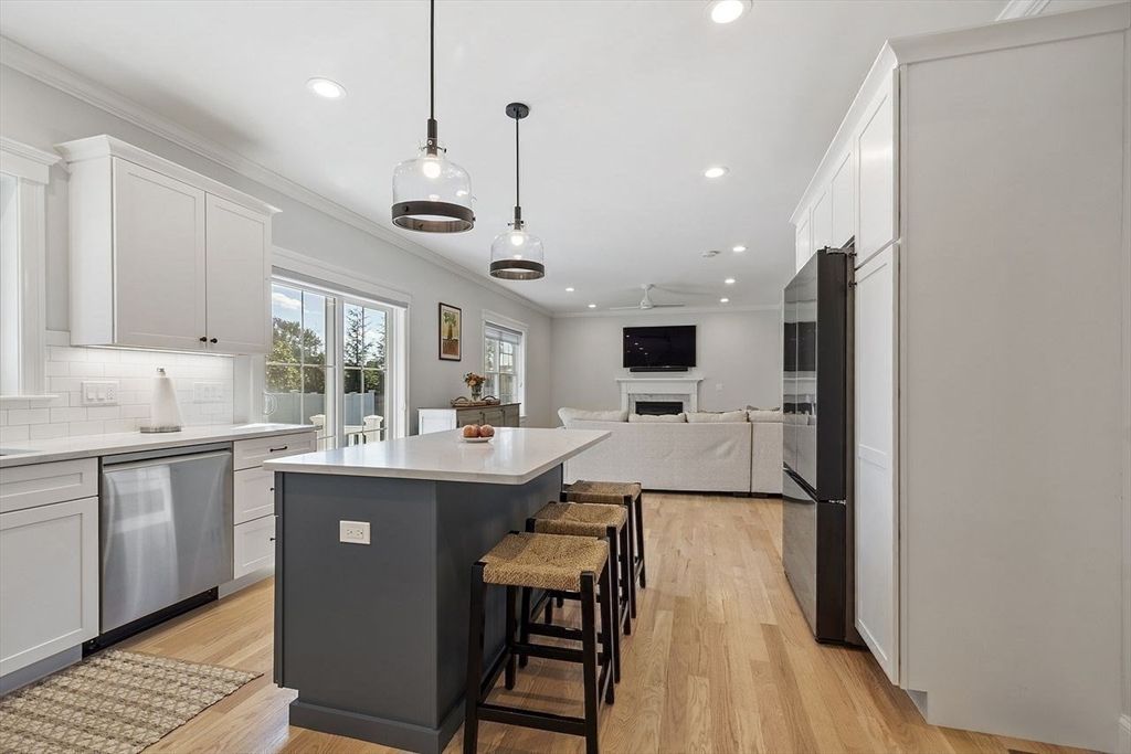 Fireplace, Interior, Kitchen, Pendant Lights, Recessed Lighting, Stainless Steel Appliances, Wood Texture Flooring