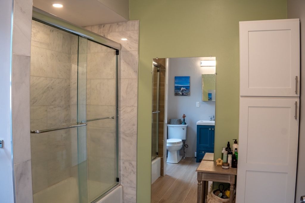 Bathroom, Glass Shower, Interior, Marble Walls, Recessed Lighting, Wood Texture Flooring