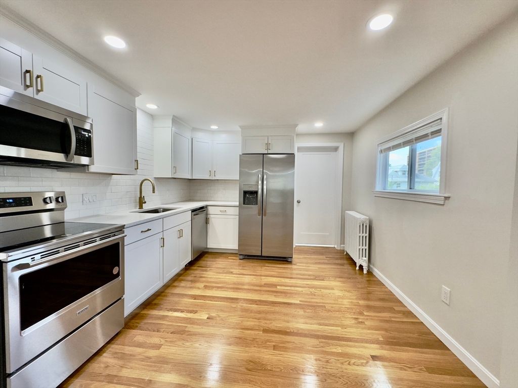 Interior, Kitchen, Recessed Lighting, Stainless Steel Appliances, Wood Texture Flooring