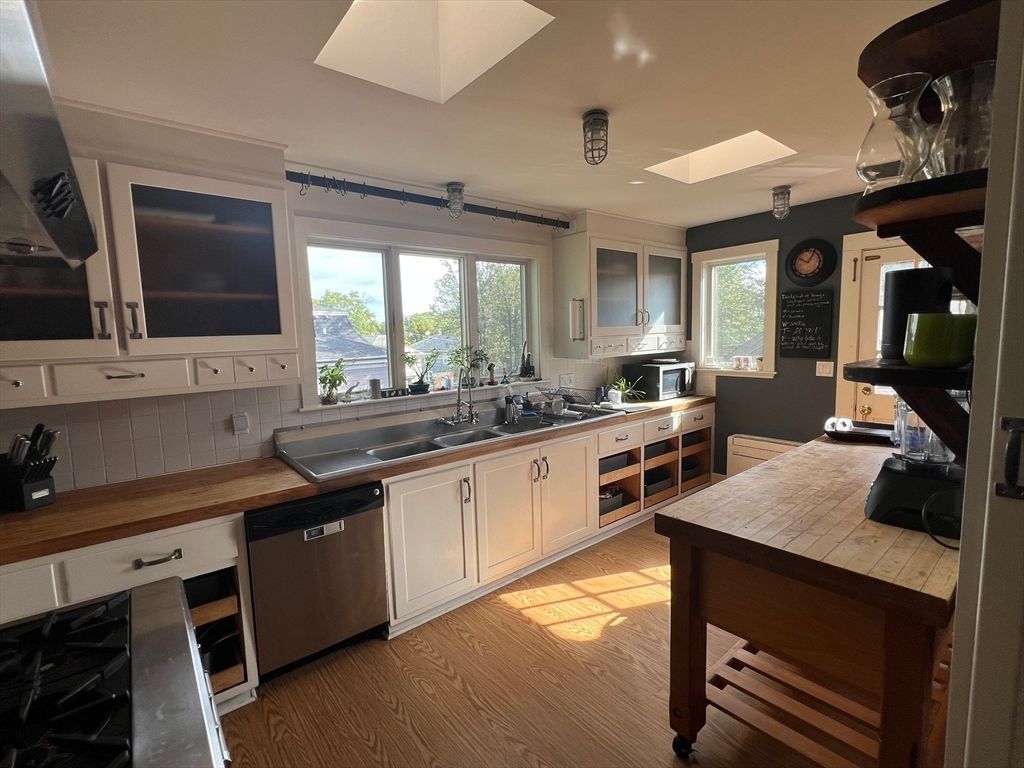 Interior, Kitchen, Recessed Lighting, Stainless Steel Appliances, Tile Countertops, Wood Texture Flooring