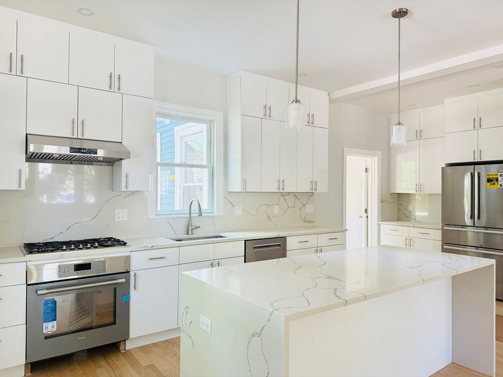 Interior, Kitchen, Marble Walls, Pendant Lights, Stainless Steel Appliances, Wood Texture Flooring