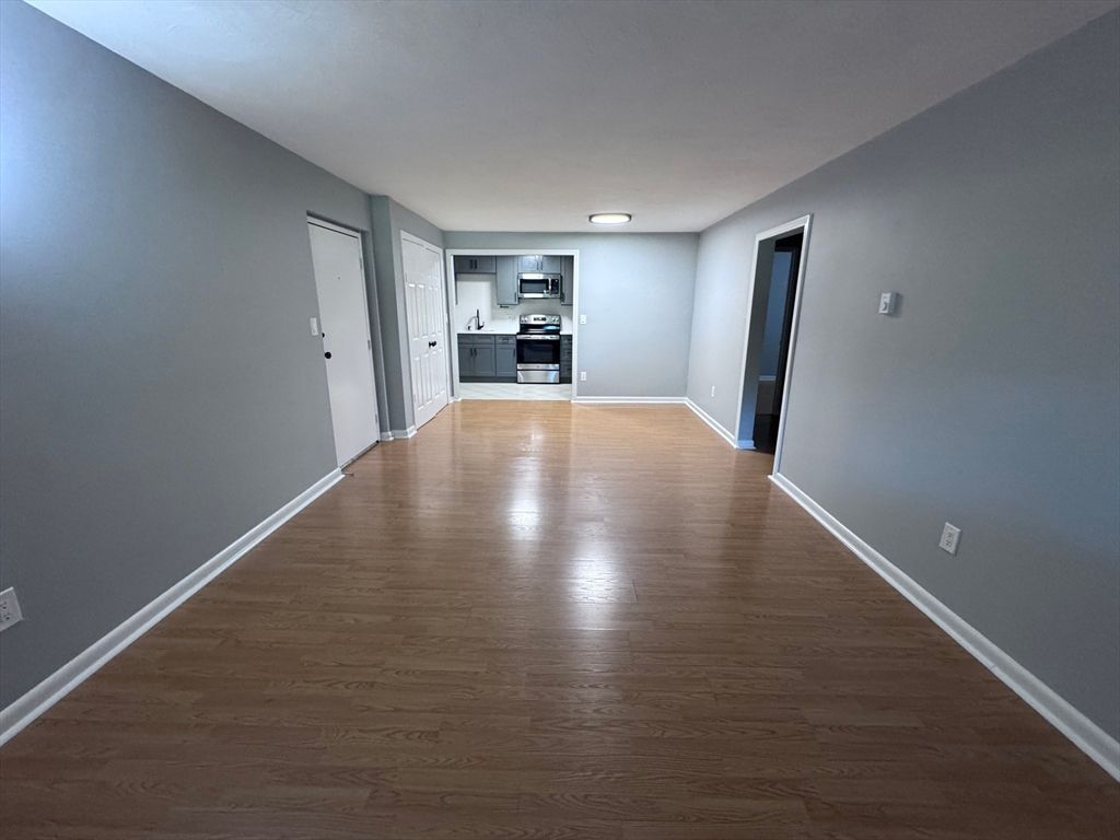 Empty room, Interior, Kitchen, Stainless Steel Appliances, Wood Texture Flooring