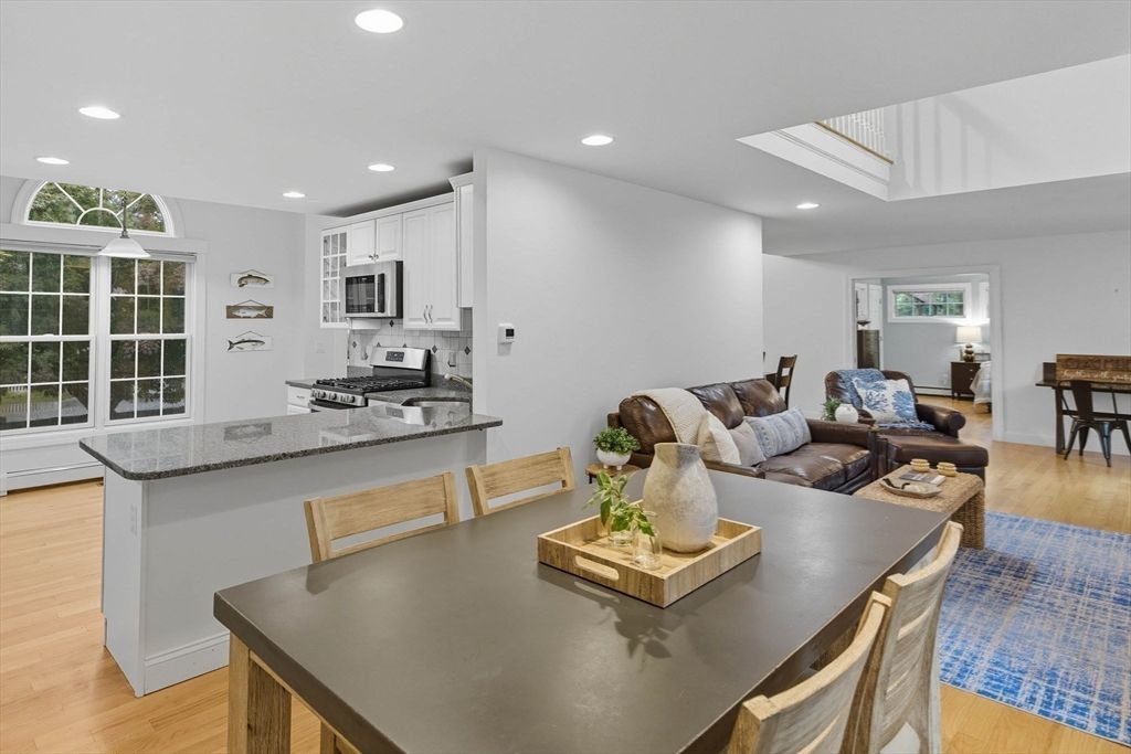 Dining room, Interior, Kitchen, Living room, Recessed Lighting, Stainless Steel Appliances, Wood Texture Flooring