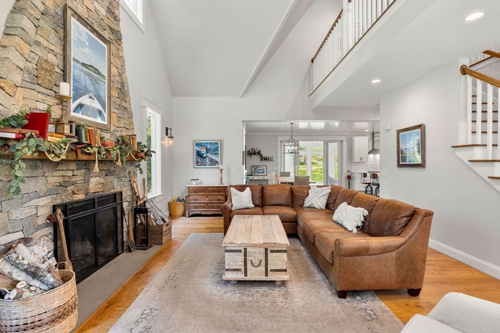 Chandelier, Dining room, Fireplace, Interior, Living room, Pendant Lights, Recessed Lighting, Stone Walls, Wood Texture Flooring