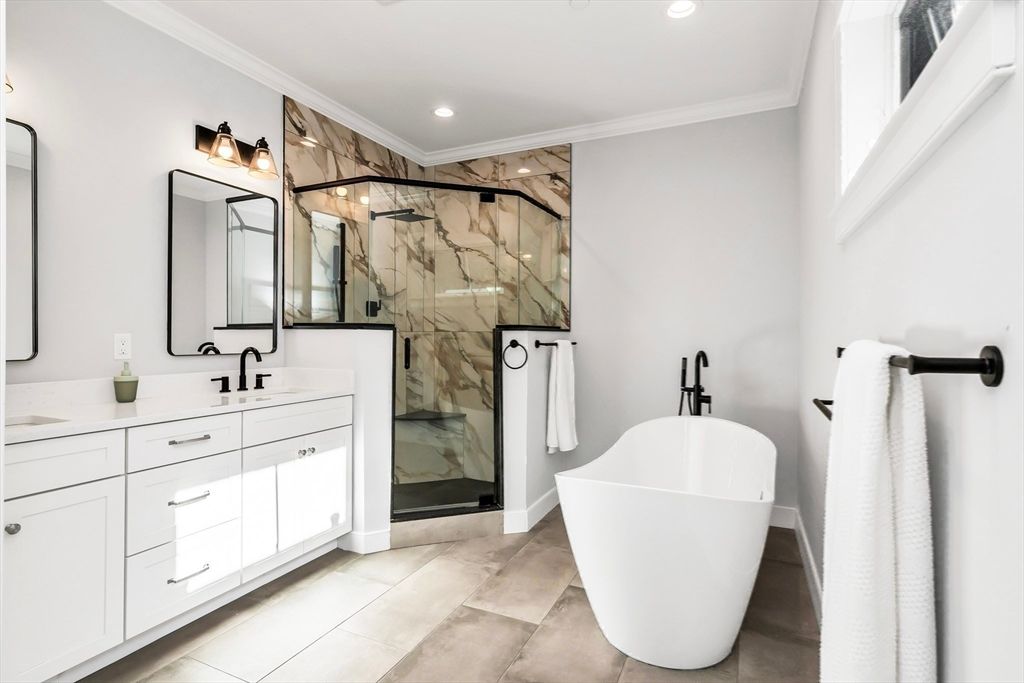 Bathroom, Dual Sink Vanities, Free Standing Baths, Glass Shower, Interior, Marble Walls, Recessed Lighting