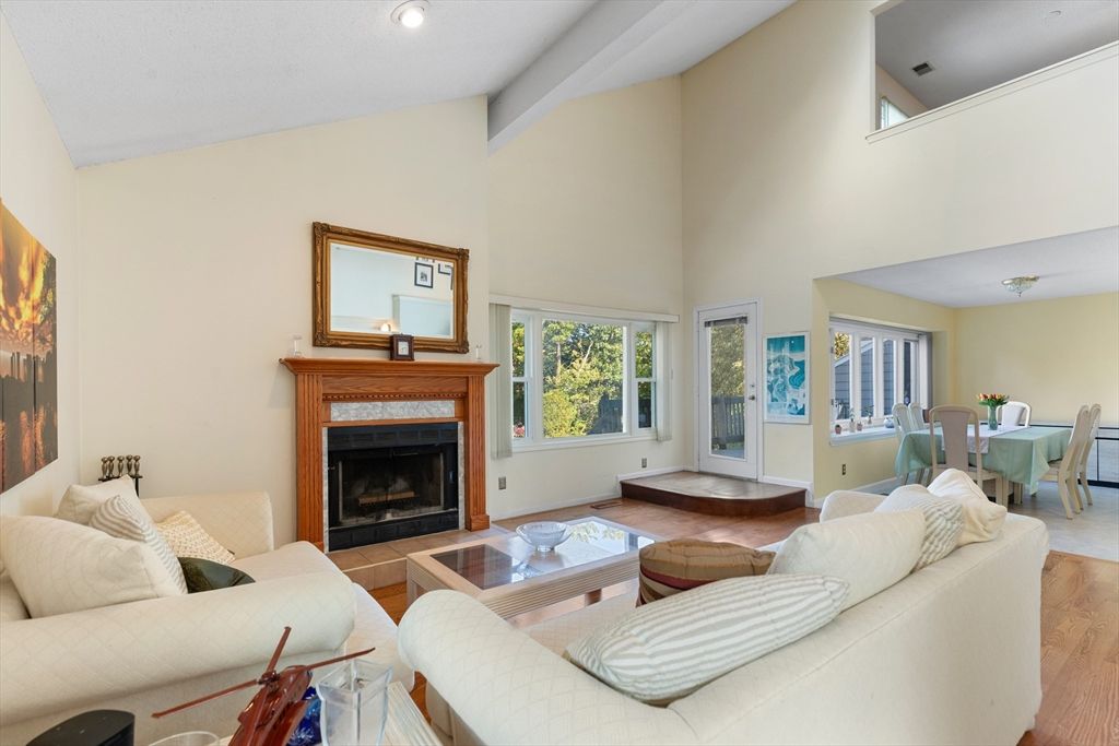 Dining room, Fireplace, Interior, Living room, Recessed Lighting, Wood Texture Flooring