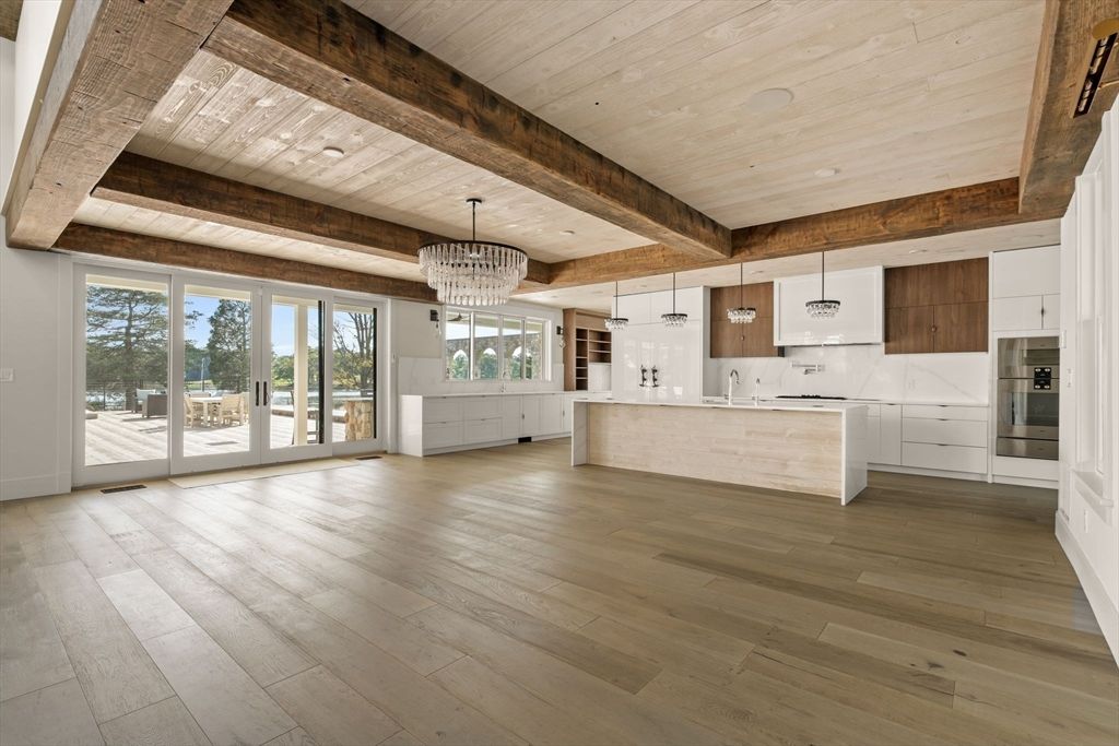 Chandelier, Empty room, Interior, Kitchen, Recessed Lighting, Stainless Steel Appliances, Wooden Beams, Wooden Ceilings, Wood Texture Flooring