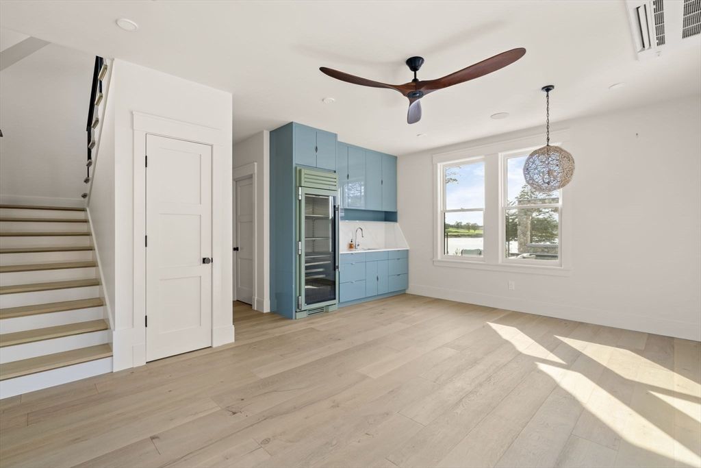 Chandelier, Empty room, Interior, Kitchen, Recessed Lighting, Stainless Steel Appliances, Wood Texture Flooring