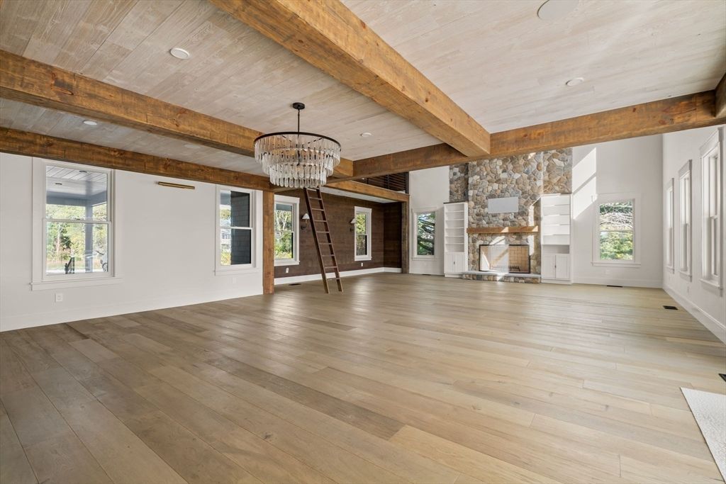 Chandelier, Empty room, Fireplace, Interior, Recessed Lighting, Wooden Beams, Wooden Ceilings, Wood Texture Flooring