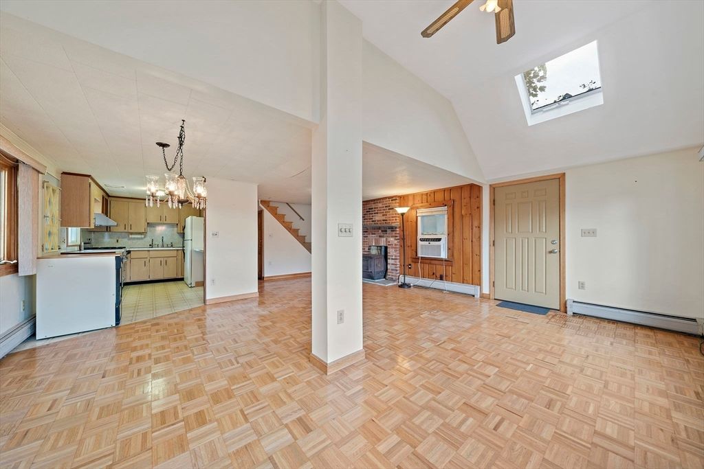 Chandelier, Empty room, Fireplace, Interior, Kitchen, Pendant Lights, Stone Walls, Wood Texture Flooring