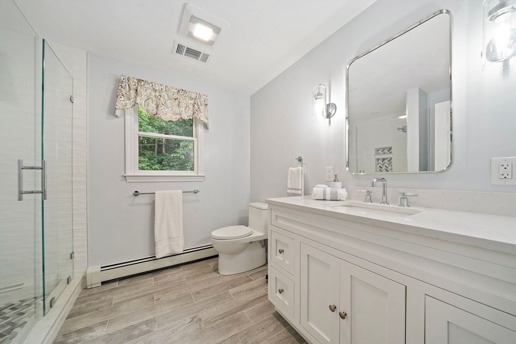 Bathroom, Dual Sink Vanities, Glass Shower, Interior, Wood Texture Flooring