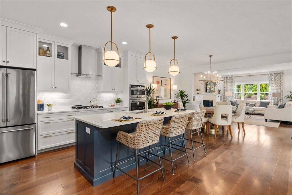 Chandelier, Dining room, Fireplace, Interior, Kitchen, Living room, Pendant Lights, Recessed Lighting, Stainless Steel Appliances, Wood Texture Flooring