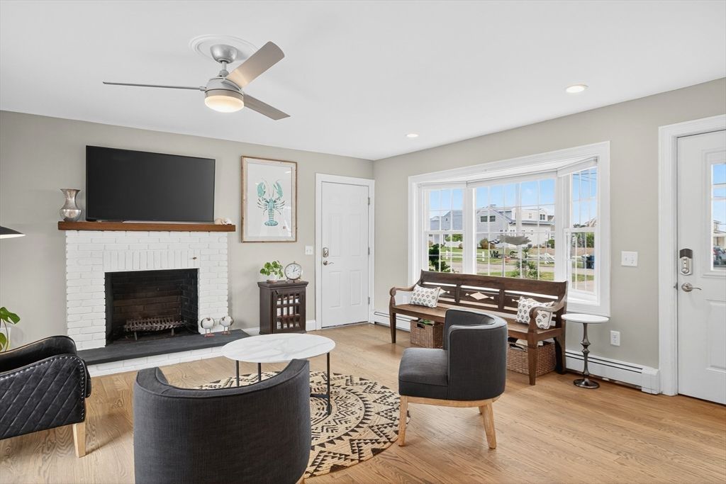 Dining room, Fireplace, Interior, Living room, Recessed Lighting, Wood Texture Flooring
