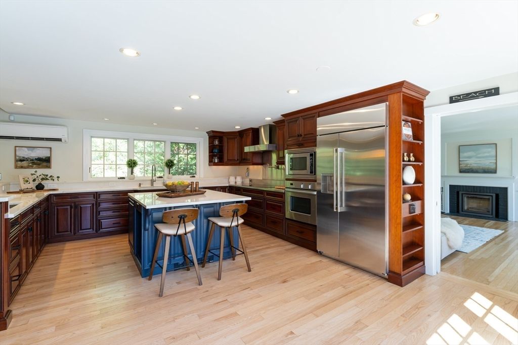 Fireplace, Interior, Kitchen, Recessed Lighting, Stainless Steel Appliances, Wood Texture Flooring