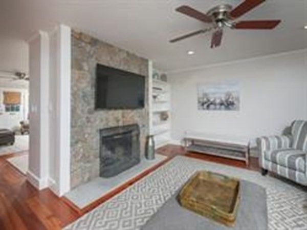 Fireplace, Interior, Living room, Recessed Lighting, Stone Walls, Wood Texture Flooring