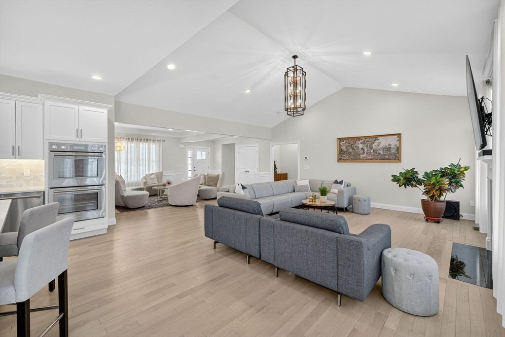 Fireplace, Interior, Kitchen, Living room, Pendant Lights, Recessed Lighting, Stainless Steel Appliances, Wood Texture Flooring