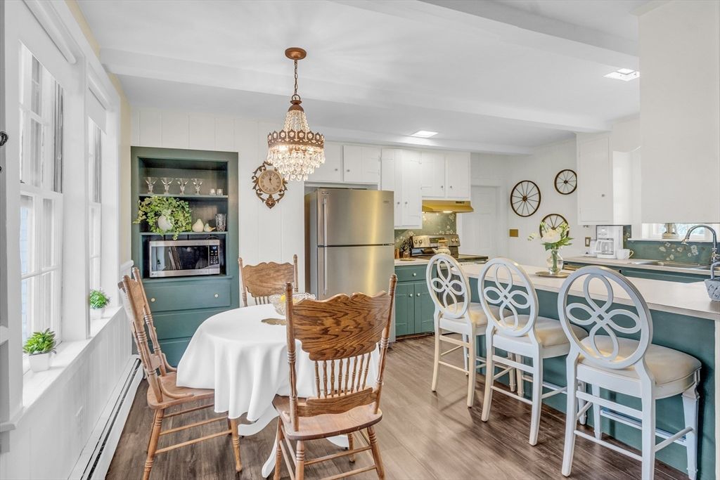 Chandelier, Dining room, Interior, Kitchen, Stainless Steel Appliances, Wood Texture Flooring