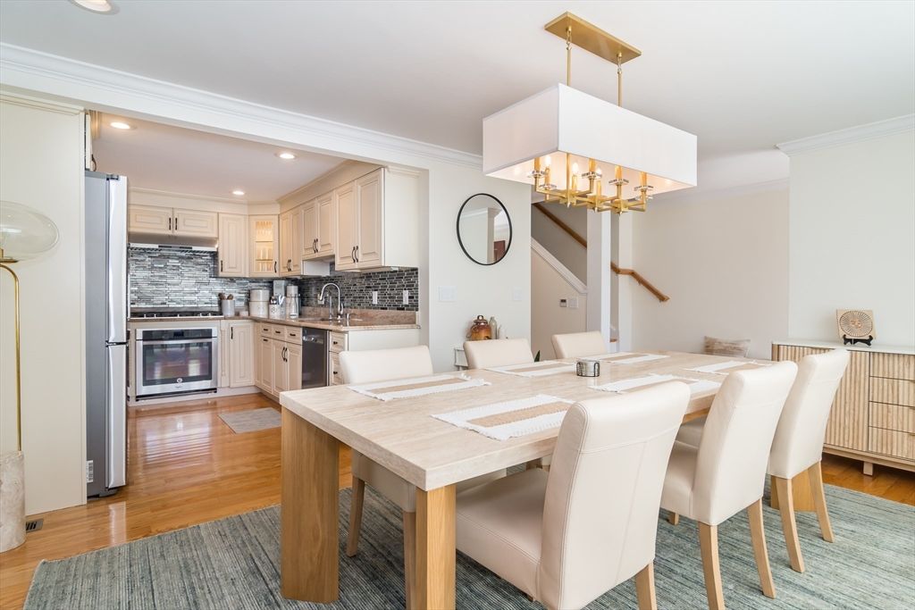 Chandelier, Dining room, Interior, Kitchen, Recessed Lighting, Stainless Steel Appliances, Wood Texture Flooring