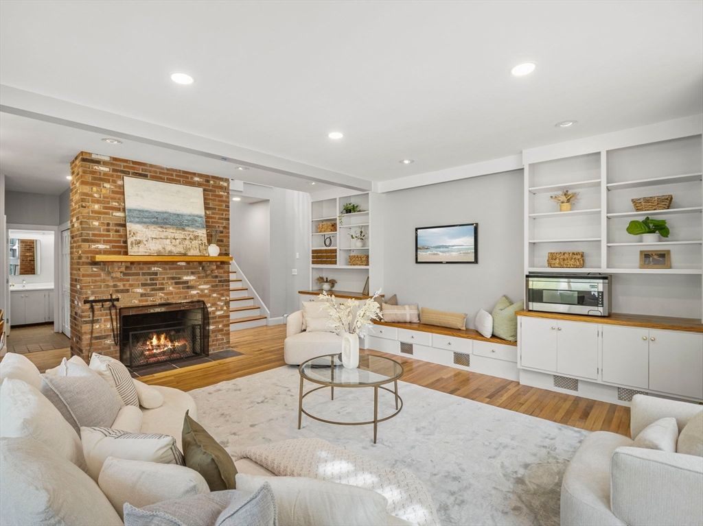 Fireplace, Interior, Living room, Recessed Lighting, Stone Walls, Wood Texture Flooring