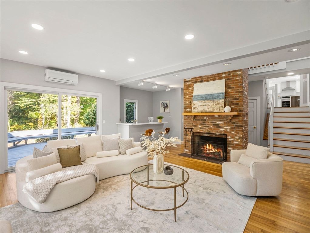 Fireplace, Interior, Living room, Recessed Lighting, Stone Walls, Wood Texture Flooring