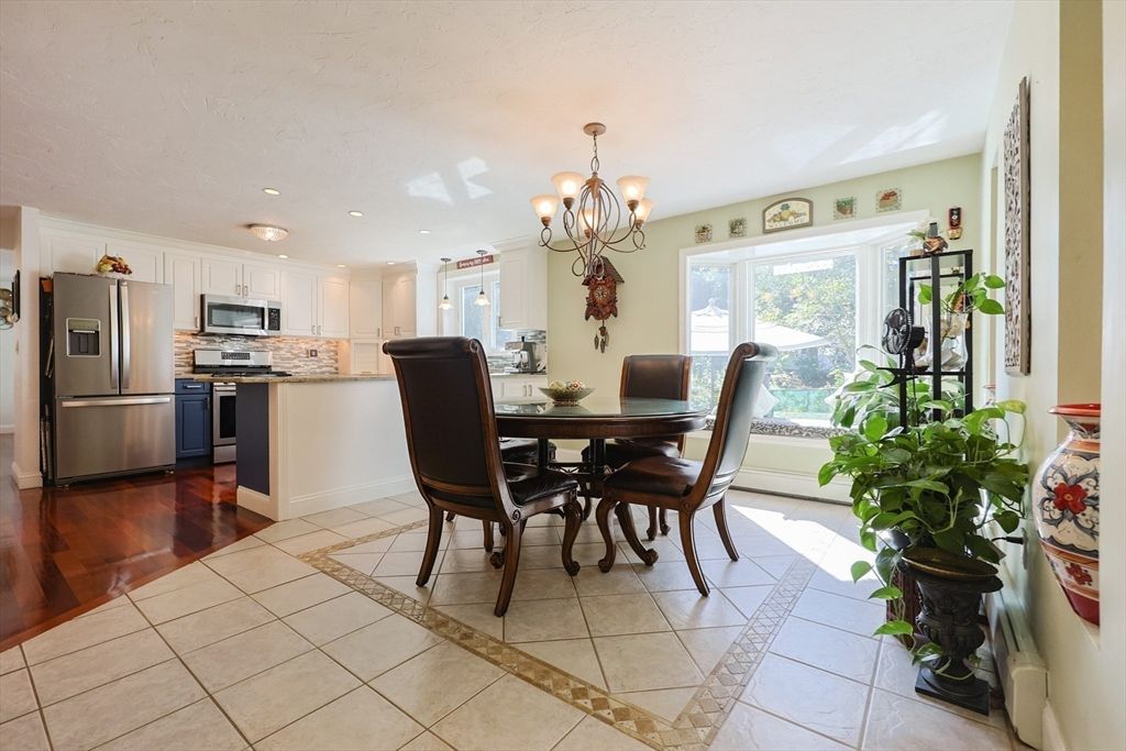 Chandelier, Dining room, Interior, Kitchen, Recessed Lighting, Stainless Steel Appliances, Wood Texture Flooring
