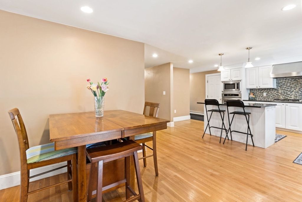 Dining room, Interior, Kitchen, Pendant Lights, Recessed Lighting, Stainless Steel Appliances, Wood Texture Flooring