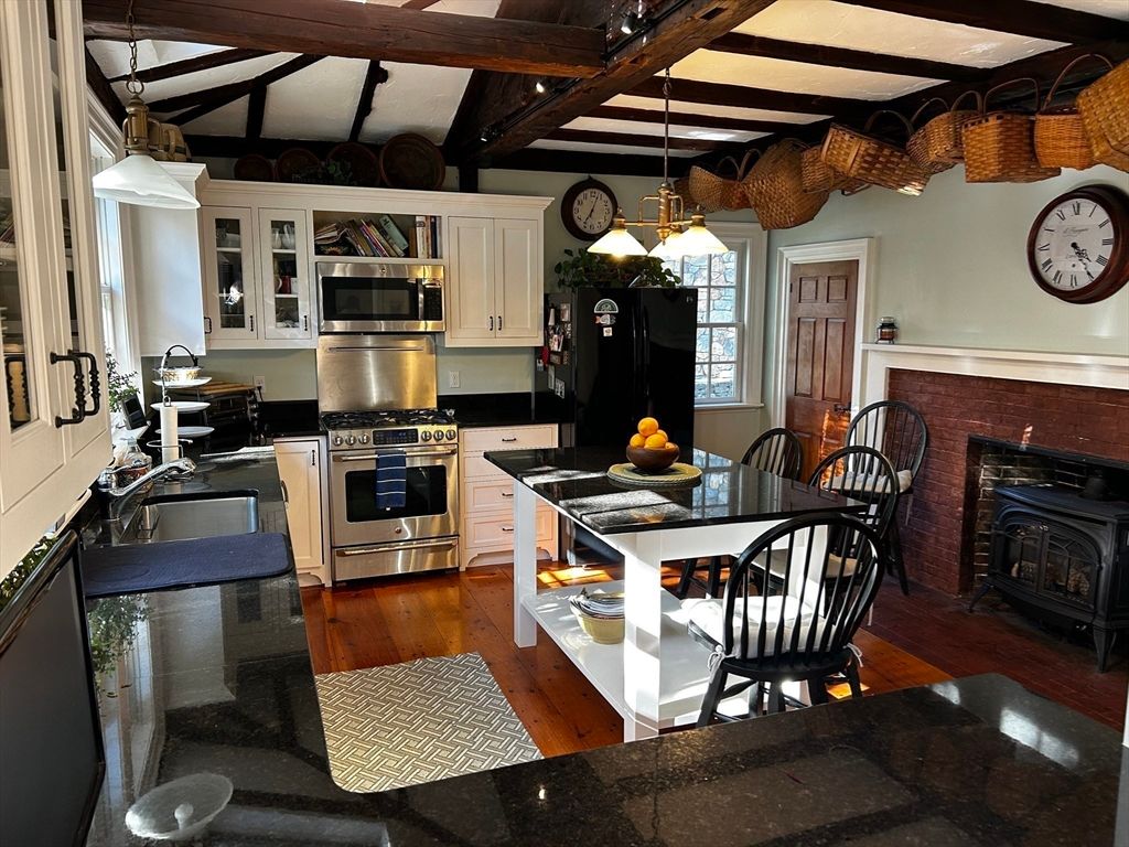 Dining room, Fireplace, Interior, Kitchen, Pendant Lights, Stainless Steel Appliances, Wooden Beams, Wood Texture Flooring