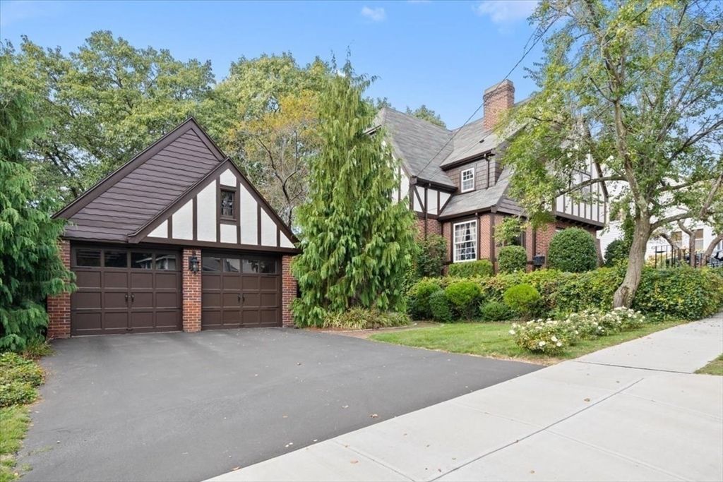 Attached, Exterior, Facade, Brick Facade, Solar Panels, Tudor Revival