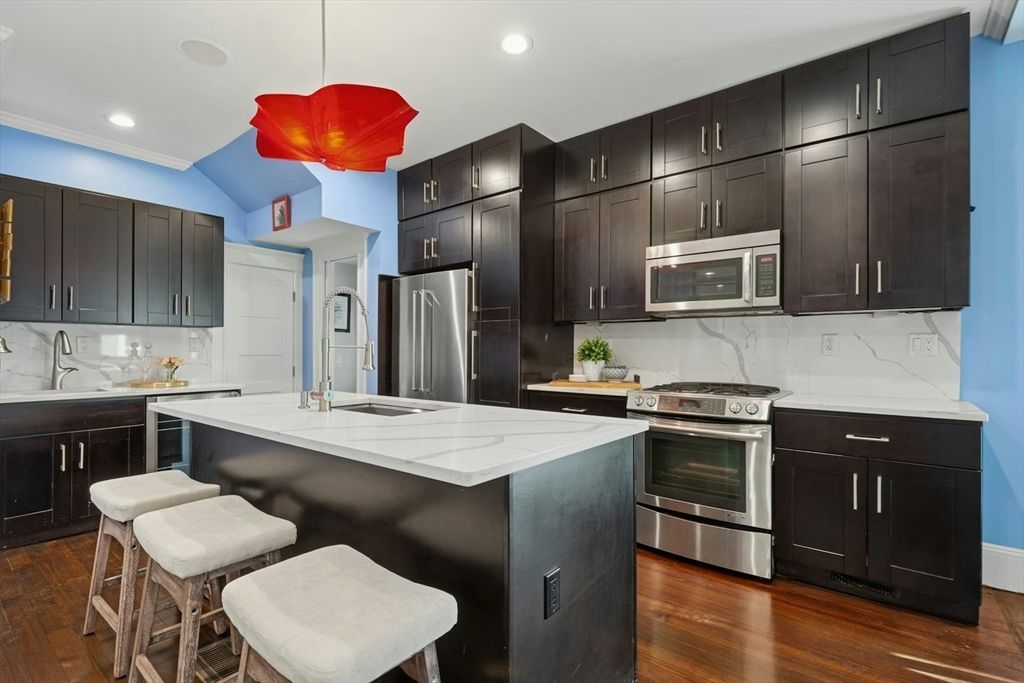 Interior, Kitchen, Marble Walls, Pendant Lights, Recessed Lighting, Stainless Steel Appliances, Wood Texture Flooring