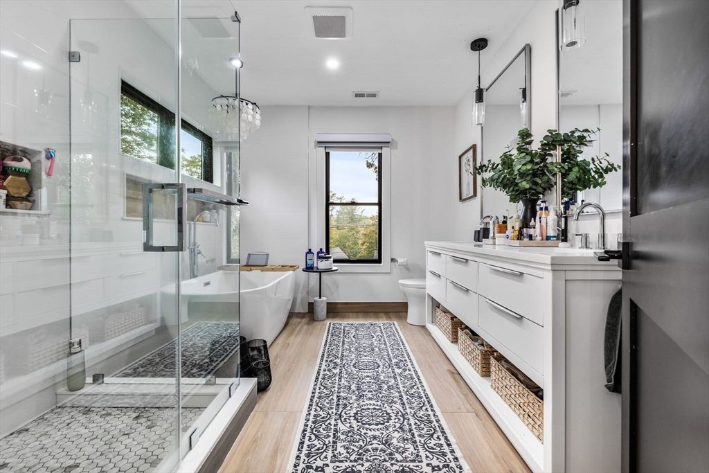 Bathroom, Dual Sink Vanities, Free Standing Baths, Glass Shower, Interior, Pendant Lights, Recessed Lighting, Wood Texture Flooring