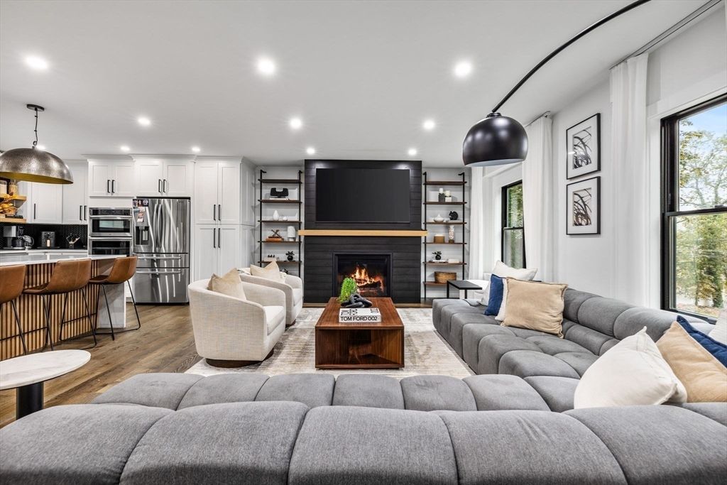 Fireplace, Interior, Kitchen, Living room, Pendant Lights, Recessed Lighting, Stainless Steel Appliances, Wood Texture Flooring