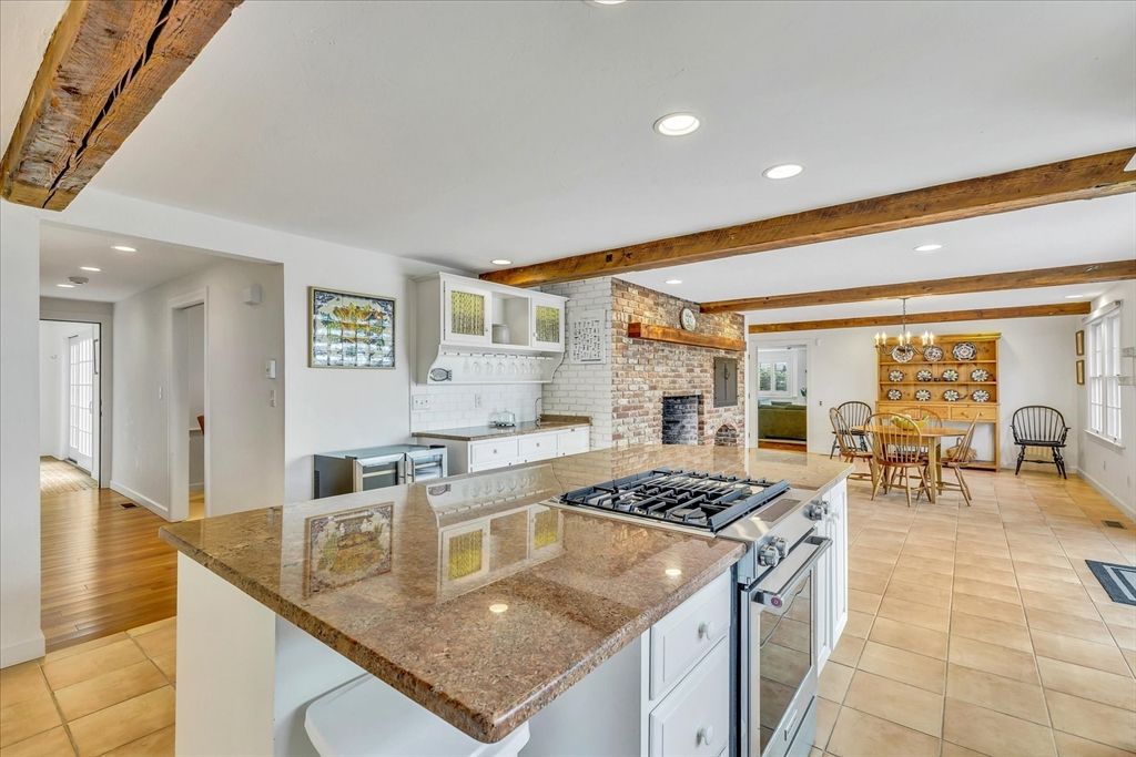 Dining room, Fireplace, Interior, Kitchen, Pendant Lights, Recessed Lighting, Stainless Steel Appliances, Stone Walls, Wooden Beams
