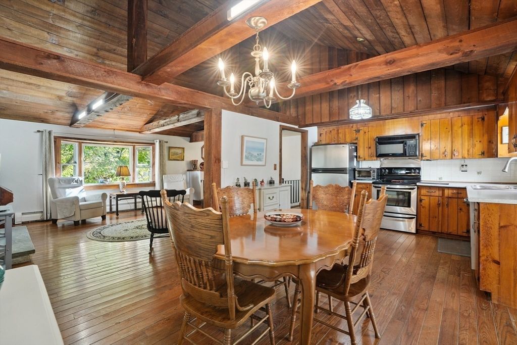 Chandelier, Dining room, Interior, Kitchen, Living room, Stainless Steel Appliances, Wooden Beams, Wooden Ceilings, Wood Texture Flooring, Wooden Walls