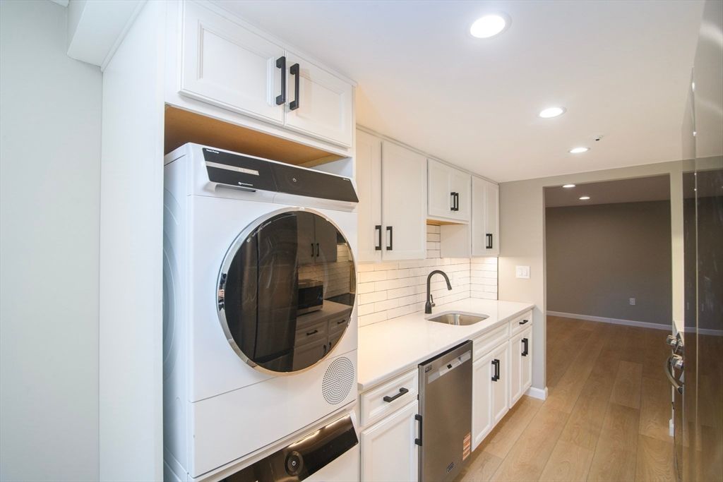 Interior, Kitchen, Recessed Lighting, Washer, Wood Texture Flooring