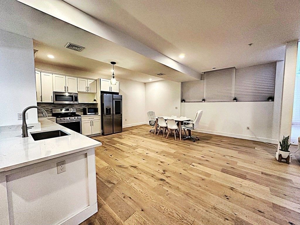 Dining room, Interior, Kitchen, Pendant Lights, Recessed Lighting, Stainless Steel Appliances, Wood Texture Flooring