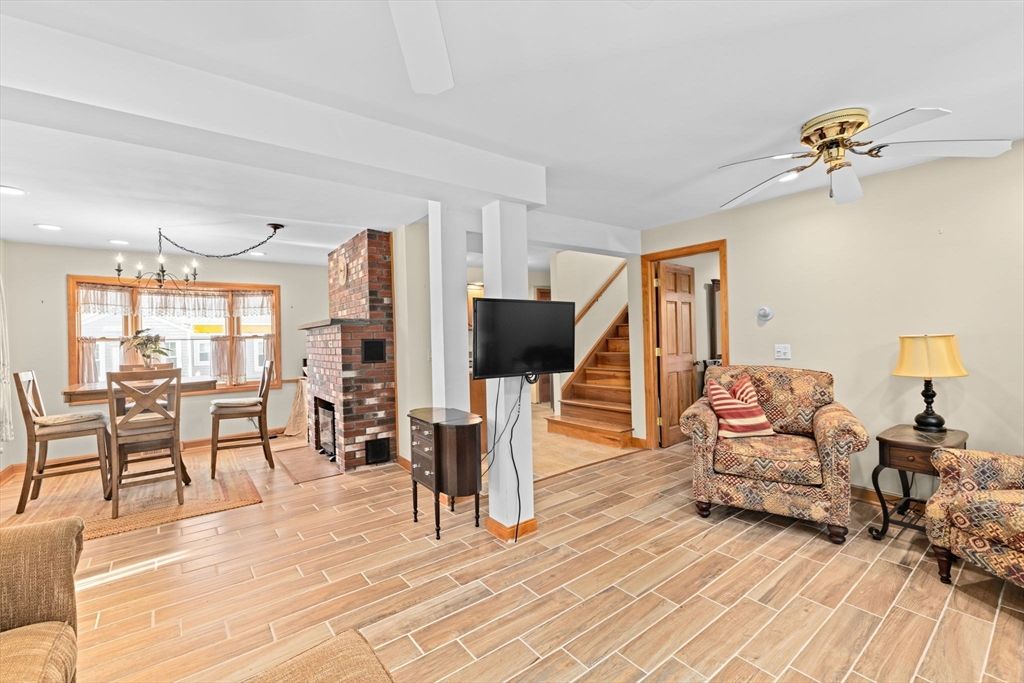 Dining room, Fireplace, Interior, Living room, Pendant Lights, Recessed Lighting, Wood Texture Flooring